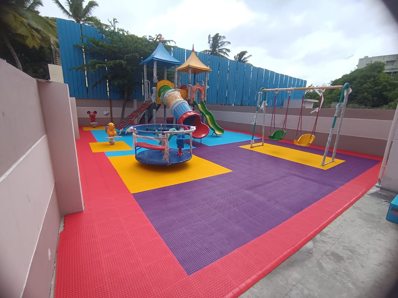 Playground with interlocking tiles